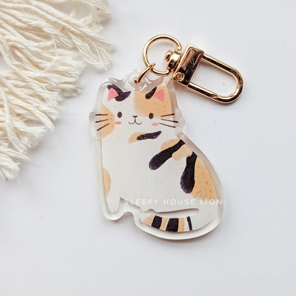 mostly white calico cat keychain