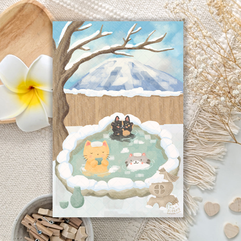 cats relaxing at a japanese onsen with mount fuji