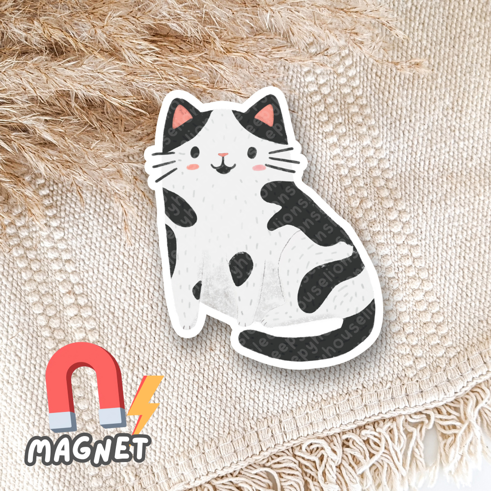 Cartoon cat with cow pattern magnet