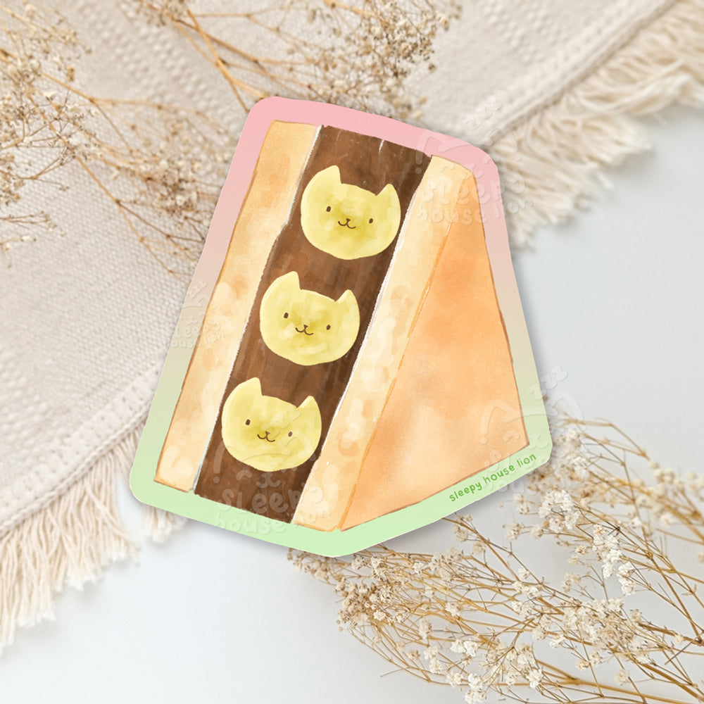 Chocolate banana fruit sandwich. Banana slices are the shape of cat heads.