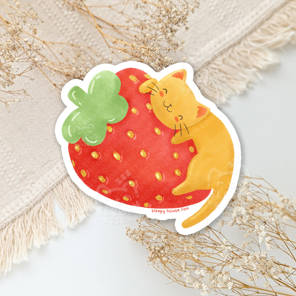 orange cat with giant strawberry vinyl sticker
