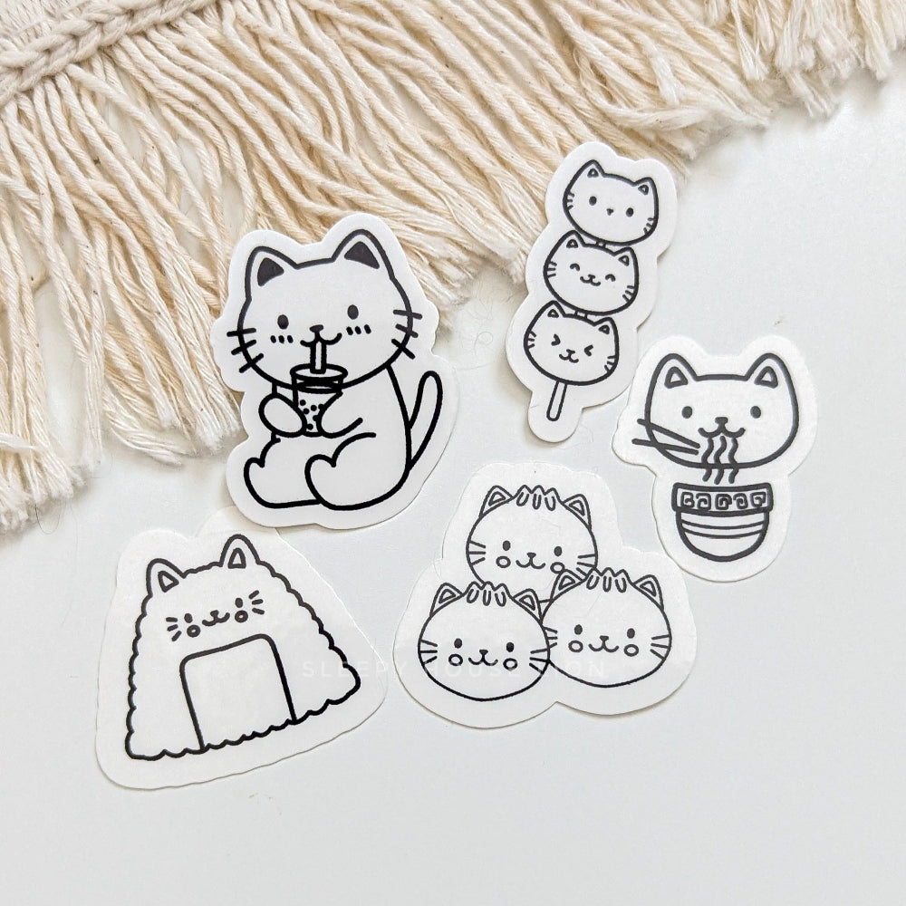 Set of black and white cat-themed temporary tattoos on a light background with decorative fringe.