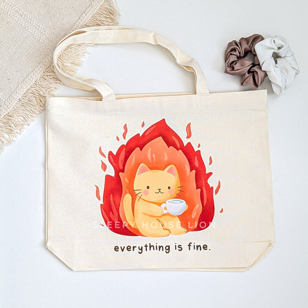 Tote bag with a cat illustration and 'everything is fine' text on a light background