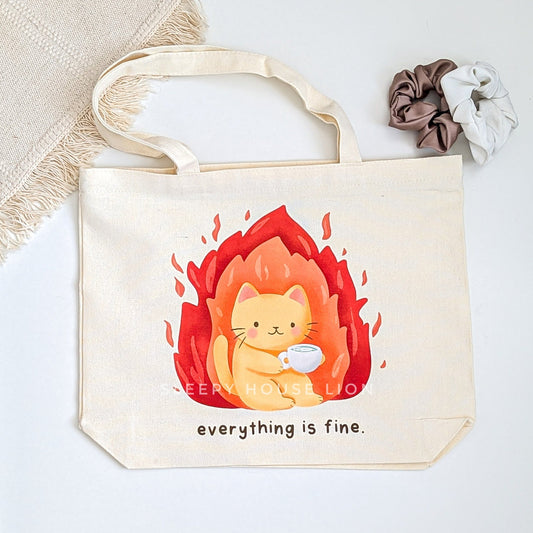 Tote bag with a cat illustration and 'everything is fine' text on a light background
