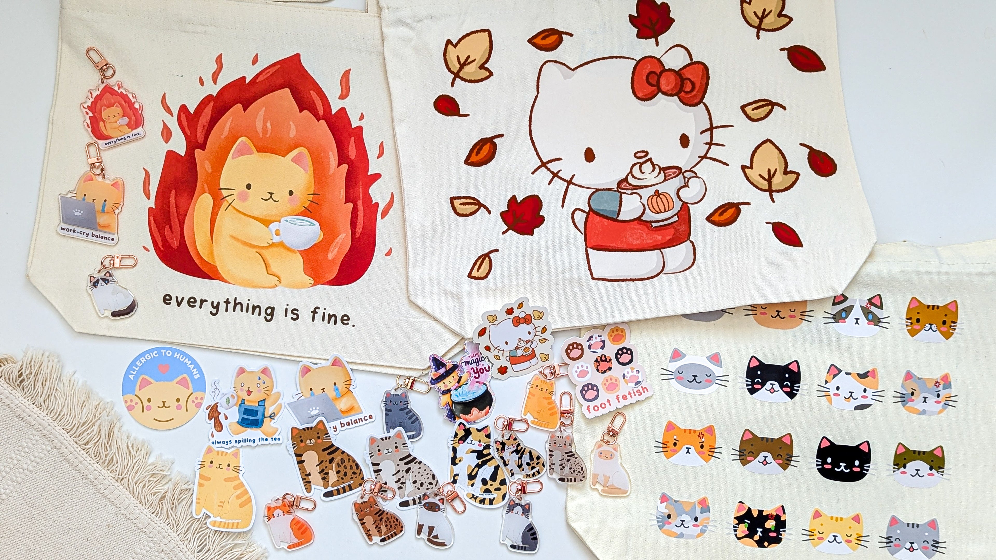 Collection of cat-themed stickers and paper with autumn design on a white background