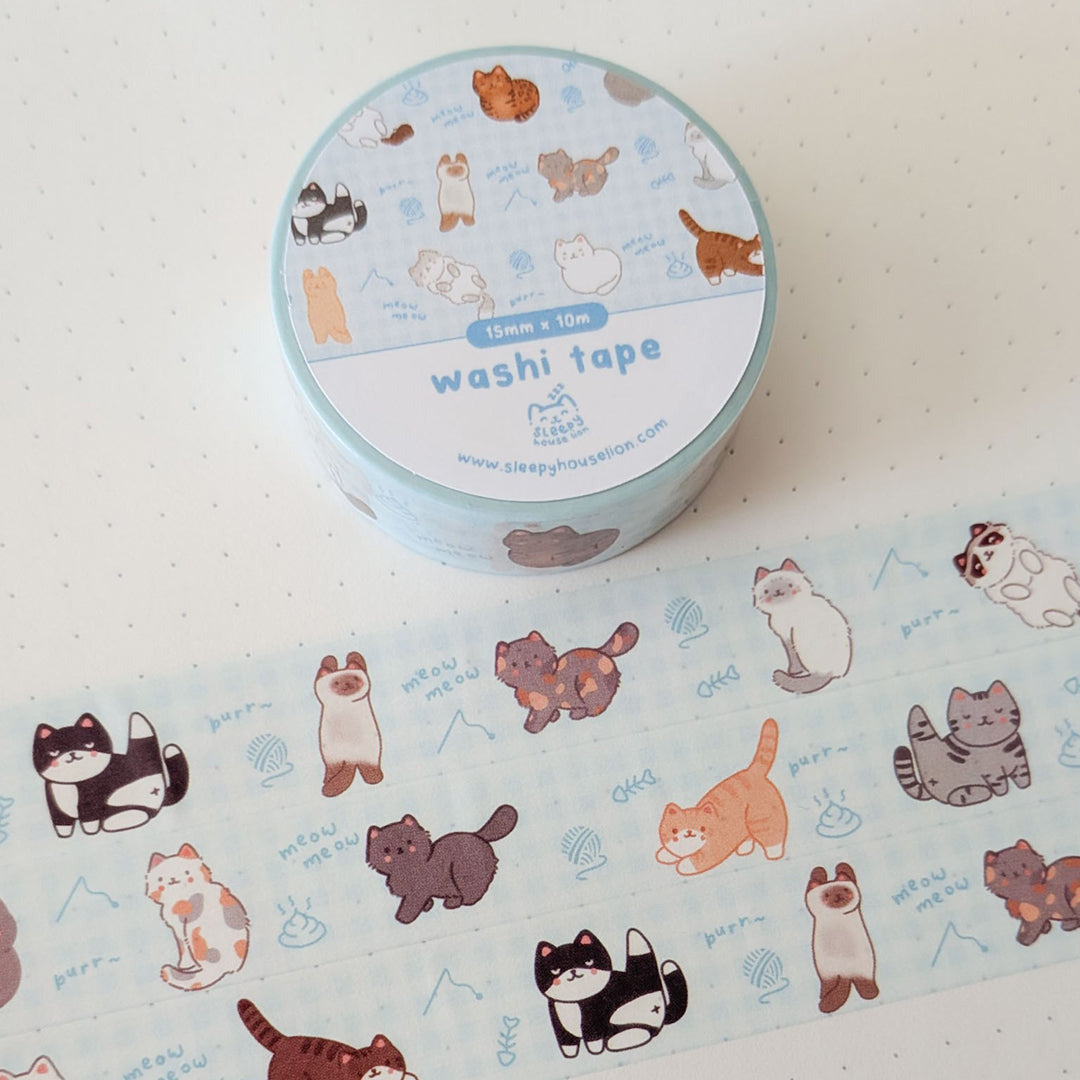 Blue Washi tape with cat designs on a white background