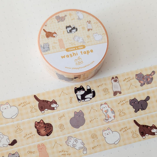 Yellow washi tape with cat designs on a white background