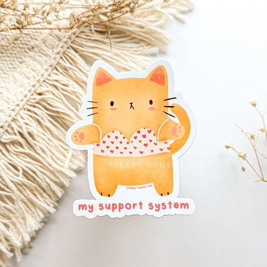 cat wearing a bra with hearts on it with quote: my support system