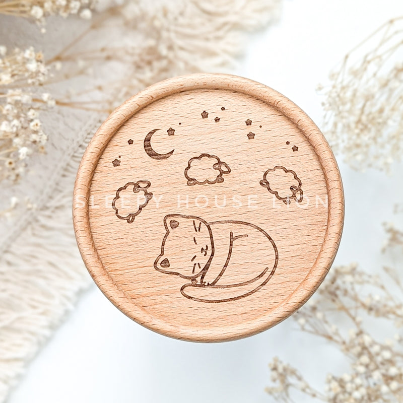 wooden engraved coaster with sleeping cat and sheep under night sky